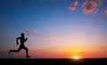 Running man silhouette in sunset time. Sport and active life con Royalty Free Stock Photo