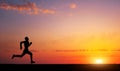 Running man silhouette in sunset time. Royalty Free Stock Photo