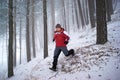 Running man in winter mountain forest Royalty Free Stock Photo