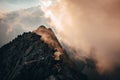 Running in mountains. Trail Run photo, sunset light . Man on yellow meadow under blue sky Royalty Free Stock Photo