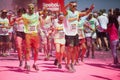 Running people at a color run in Cologne