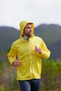 Running, rain and man with exercise, training and endurance with progress and dedication with nature. Wet, runner and Royalty Free Stock Photo