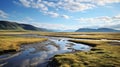 Running River In Grass And Mountains: A Lively Coastal Landscape