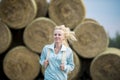 The running romantic girl outdoors against hay stack Royalty Free Stock Photo