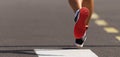 Running shoe closeup of man running on city road Royalty Free Stock Photo