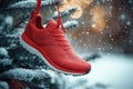 A running shoe hanging on a red ribbon in Christmas tree. Generative AI. Royalty Free Stock Photo