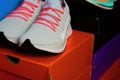 Running shoe on orange box with sport shoes background