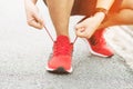 Running shoes. Barefoot running shoes closeup. male athlete tying laces for jogging on road. Royalty Free Stock Photo