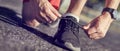 Running shoes - closeup of man tying shoe laces. Royalty Free Stock Photo