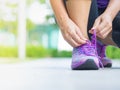 Running shoes - closeup of woman tying shoe laces. Royalty Free Stock Photo