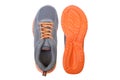 Running shoes with grey and orange colors