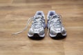 Running shoes on a gym floor after workout Royalty Free Stock Photo