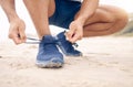 Running shoes, hands and fitness man at a beach for training, exercise or morning cardio zoom. Legs, closeup and male Royalty Free Stock Photo