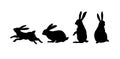 Running, sitting and standing rabbit. Black cut silhouette on a