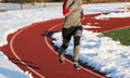 Running on a snow shoveled track in sunshine Royalty Free Stock Photo