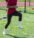 Running in socks over yellow mini hurdles Royalty Free Stock Photo