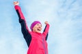 Running and sport success. Happy woman celebrating victory and raises his hands up. Female runner successful against the blue sky Royalty Free Stock Photo