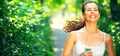 Running sporty girl. Beauty young woman jogging in the park Royalty Free Stock Photo