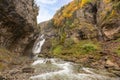 Running stream from Cascada Del Estrecho Estrecho waterfall in Ordesa valley, in Autumn season