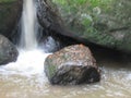 Running stream of water falling over the rocks of a waterfall in Escorredouro hike, Socorro city, Brazil. Royalty Free Stock Photo