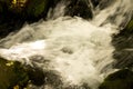 Running stream of water in a mountain river . Selective focus Royalty Free Stock Photo