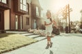 Cheerful little child in summer outfit playing outside