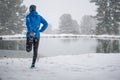 Running stretching. Athlete at the top of the mountain. Royalty Free Stock Photo