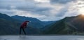 Running stretching. Athlete at the top of the mountain Royalty Free Stock Photo