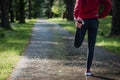 Running stretching runner doing warm-up before the marathon Royalty Free Stock Photo