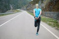 Running stretching runner doing warm-up before the marathon. Royalty Free Stock Photo