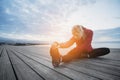 Running stretching before running. Athlete on the seacoast. Royalty Free Stock Photo