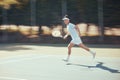 Running, tennis and action with athlete playing on game court for fitness, training and sports workout. Exercise