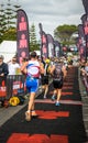 Running to the finish line in the Busselton half ironman Royalty Free Stock Photo