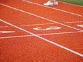 Running track closeup three number rubber orange color Royalty Free Stock Photo