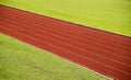 Running Track and green grass At Sport Stadium Royalty Free Stock Photo