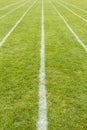 Running track lines marked on the grass