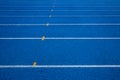 Running track with number. Blue running track in stadium.