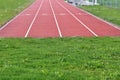 Running track for races over short distances or sprints with four lanes numbered from one to four. Royalty Free Stock Photo