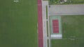 Running track of the stadium with a bird`s-eye view. Span drone over the sports complex in the open. View from the quadrocopter on