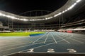 Running Track in a Stadium at Night Royalty Free Stock Photo