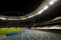 Running Track in a Stadium at Night Royalty Free Stock Photo