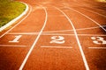 Running track start line texture with lane numbers Royalty Free Stock Photo