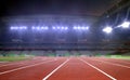 Running tracks in a stadium under spotlights Royalty Free Stock Photo