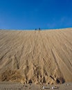 Running up a sand dune for fun on a 4WD desert safari on the Skeleton Coast of Namibia, south west Africa Royalty Free Stock Photo