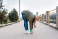 Running Warm Up, Warming Up Before Run, Prerun Warmup. Sporty woman stretching legs before jogging. Female Runner doing Royalty Free Stock Photo