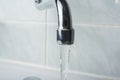 Running water faucet in the bathroom Royalty Free Stock Photo