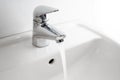 Running water tap at a wash basin, hygiene and hand washing is an important preventive measure against coronavirus infection, copy Royalty Free Stock Photo