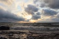 The running waves on the sandy snow-covered coast on a reservoir Royalty Free Stock Photo