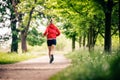 Running woman, enjoying summer day in park Royalty Free Stock Photo