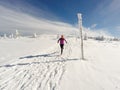 Running woman on winter trail, snow and white mountains Royalty Free Stock Photo